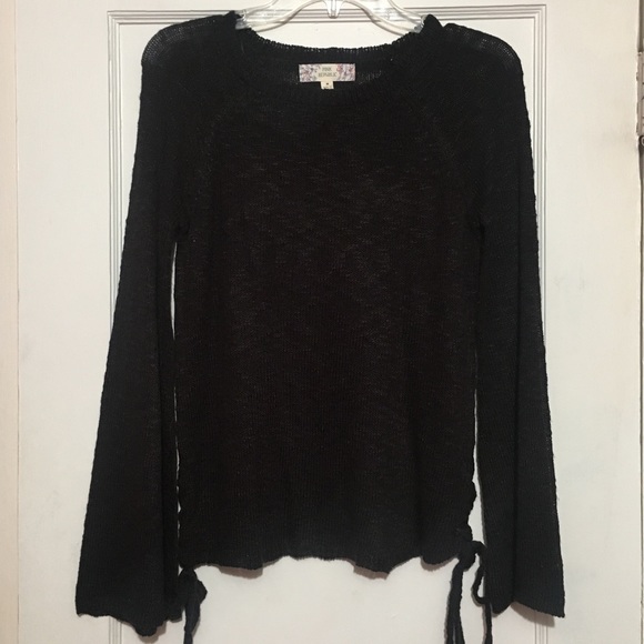 Flared knit sweater with braided sides. - Picture 1 of 3